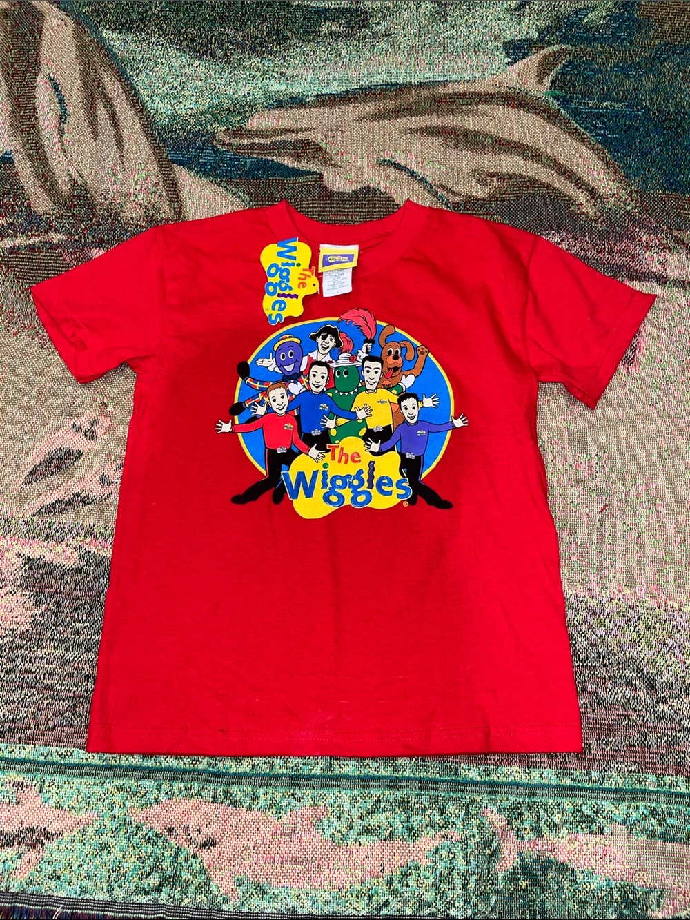 vintage children's graphic t-shirt featuring children's music group, The Wiggles